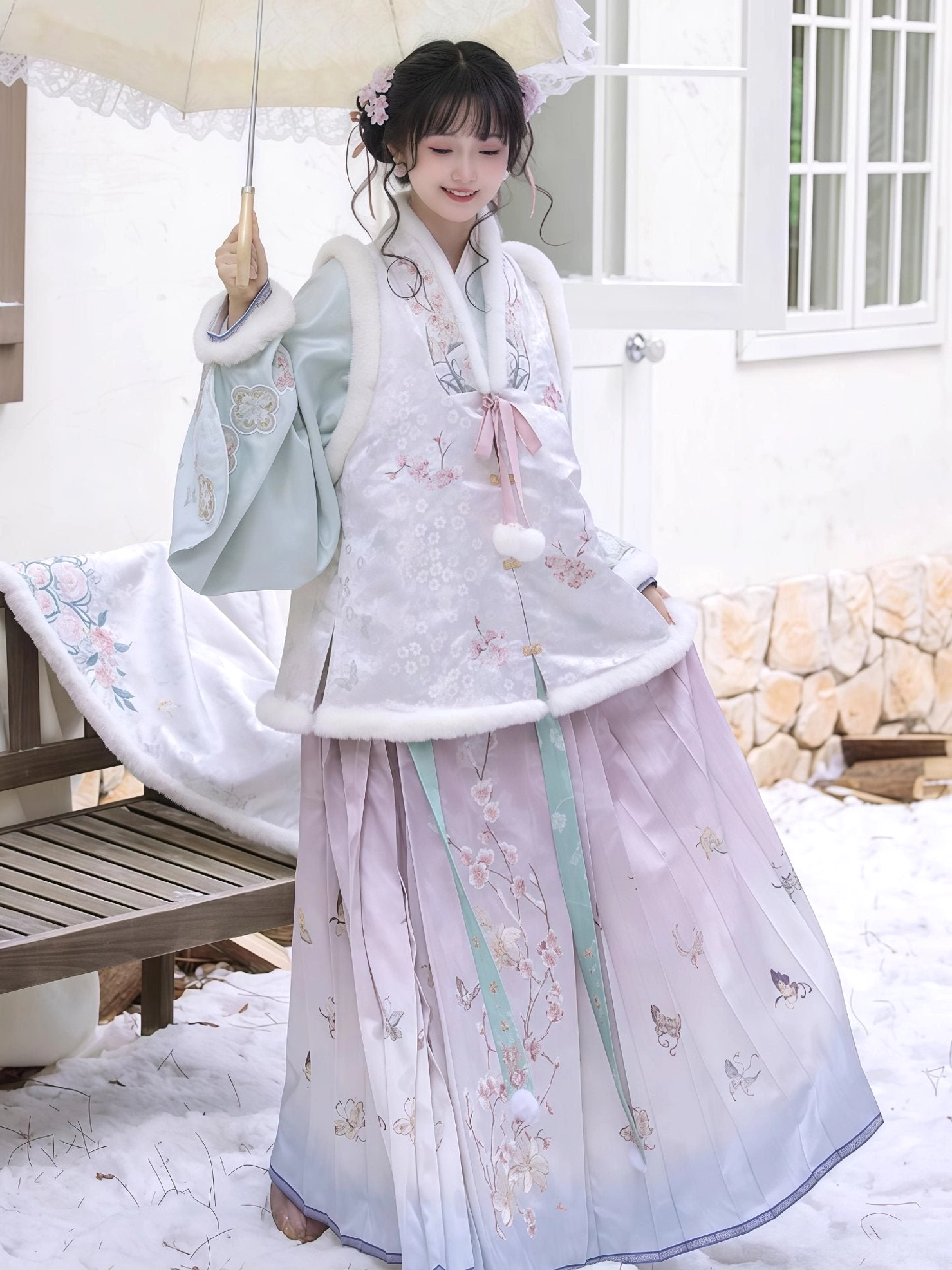 Winter Ming Dynasty Hanfu outfit with embroidered bijia vest pipa sleeves mamian skirt and lace parasol in snow