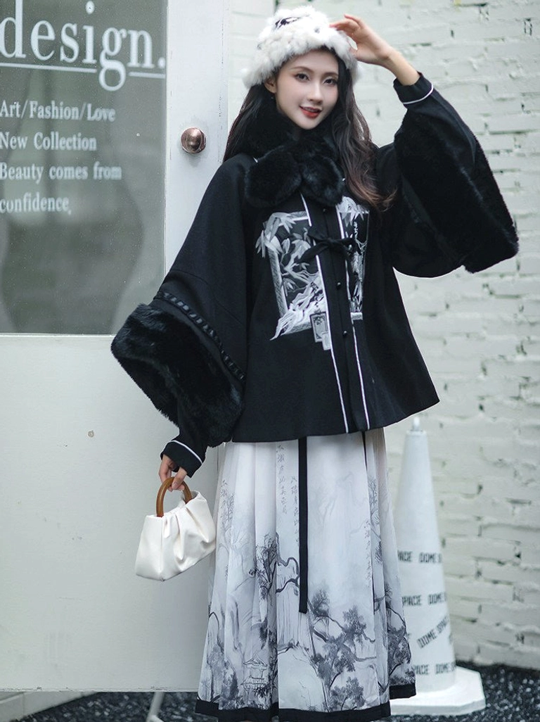 Three-quarter view of a winter-inspired Ming Dynasty hanfu set with black fluffy collar, flowing bell sleeves, and monochrome Chinese ink landscape horse face skirt