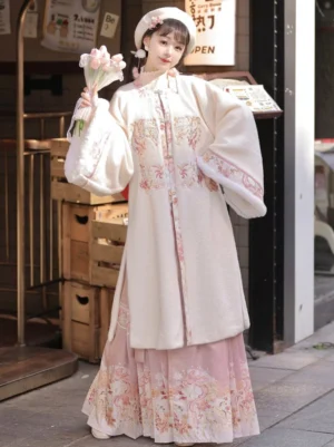 Pink Ming Dynasty Hanfu two-piece set featuring a cream embroidered velvet square collar cardigan and pink printed mamian skirt with bouquet