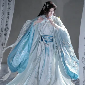 Blue flowing-sleeve cross-collar hanfu for men shown in a front three-quarter view with bamboo embroidery and blue waist sash
