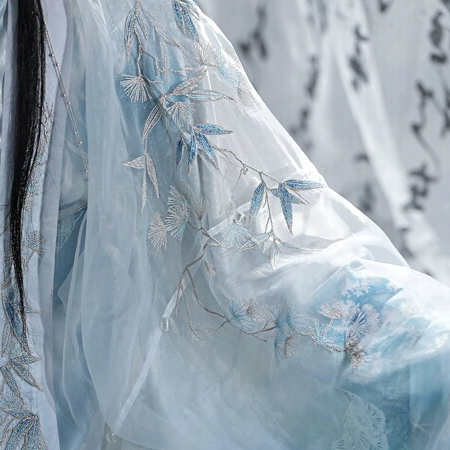 Close-up of pine and bamboo embroidery on sheer light cyan fabric from the Winter’s Noble Trio men’s hanfu set