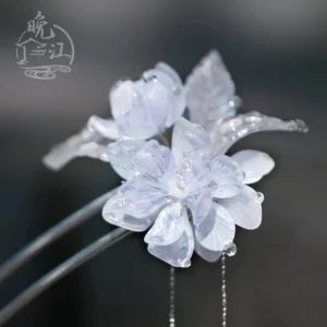 Side close-up of a traditional Chinese flower hair stick showing glossy layered translucent petals, icy blue leaves, and elegant Hanfu hair accessory details