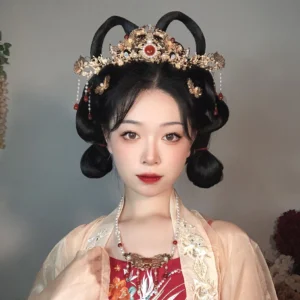 Woman wearing a complete red and gold Hanfu hair accessories set with crown tassel hairpins and earrings styled with a traditional Song-style Hanfu updo