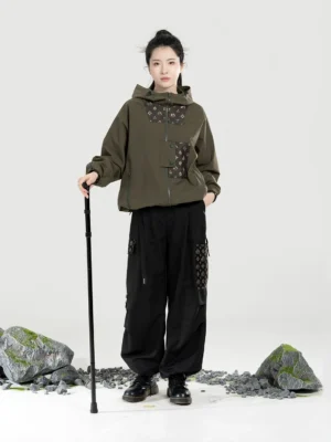 Women’s olive green Modern Hanfu outdoor outfit with half-zip hooded jacket relaxed straight-leg cargo pants and walking stick
