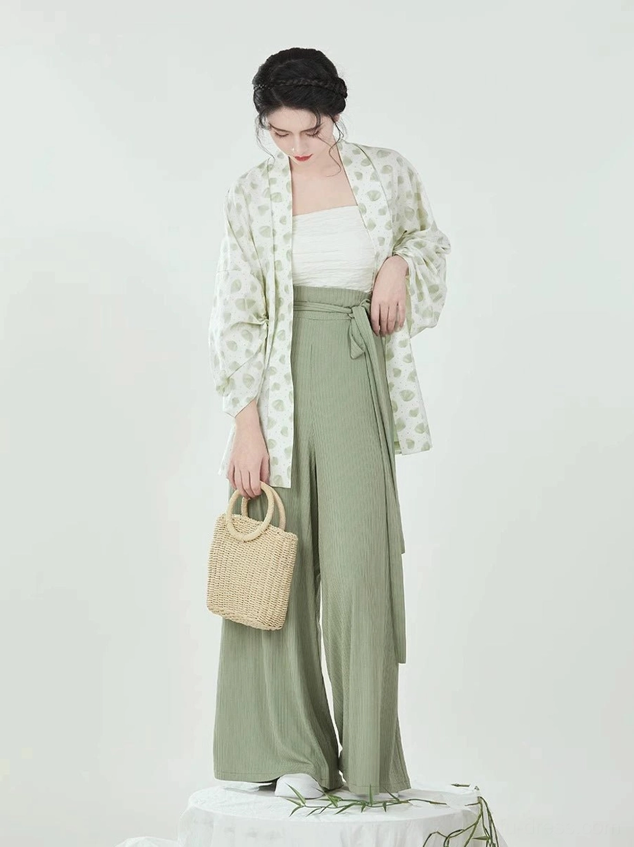 Front view of Wrapped Leaves Hanfu outfit highlighting the high-waisted sage green pants and wrap-around waist tie detail