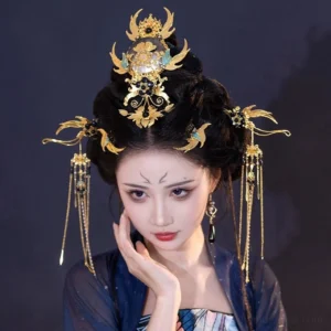Three-quarter portrait of Xi Wei Chinese Hanfu hair accessory set with gold crown, blue accents, side ornaments and long tassel hair jewelry