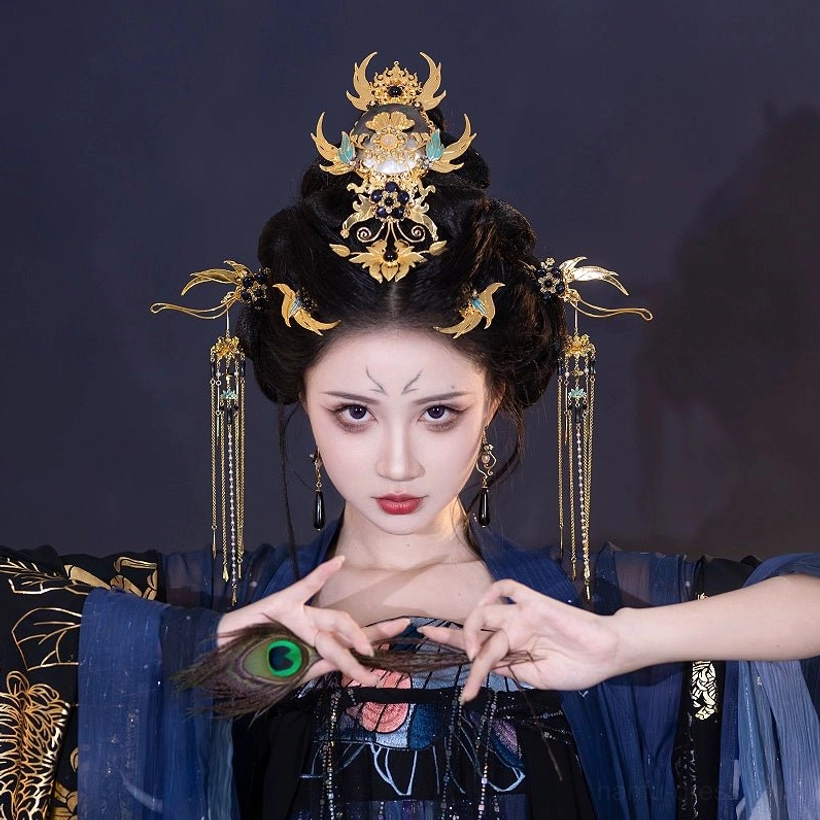 Xi Wei complete gold and blue Hanfu hair accessories set worn with dark blue traditional Chinese Hanfu, featuring crown, tassel hairpins and ornate side ornaments