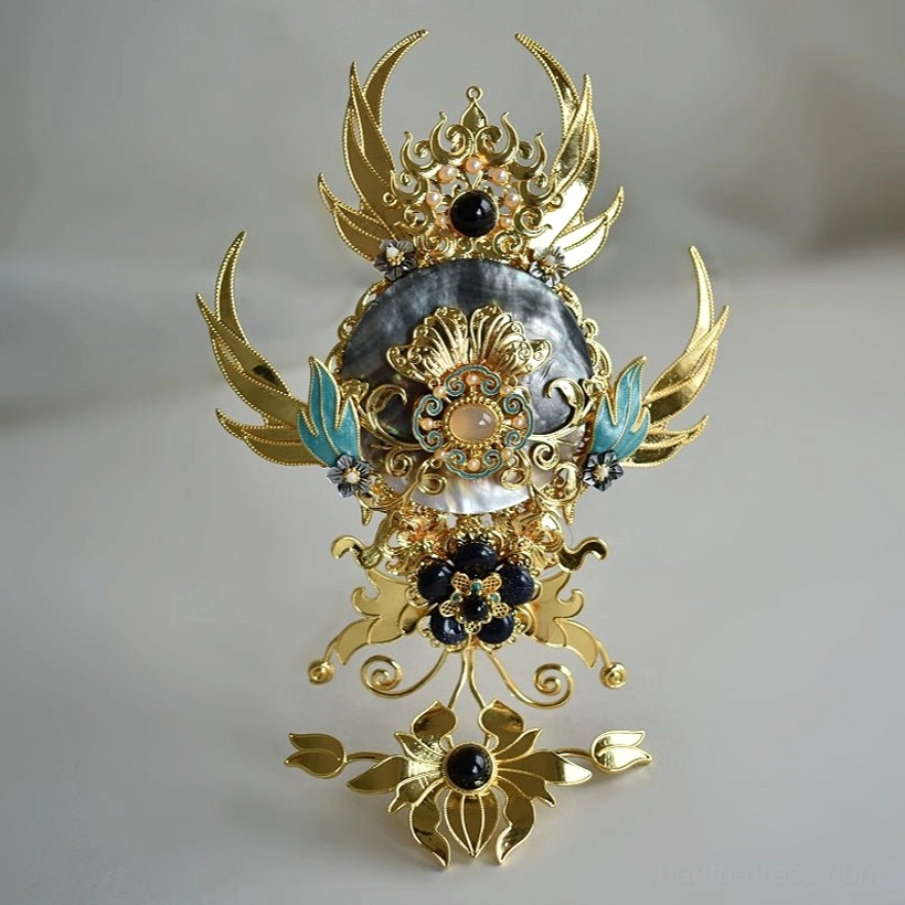 Angled product view of Xi Wei ornate Chinese Hanfu hair crown with gold-tone filigree, blue-green enamel-style details and dark gemstone-style accents