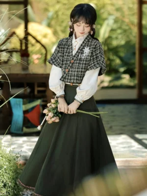 Women’s modern Hanfu layered outfit with floral brooch houndstooth vest white blouse and high waisted green midi skirt