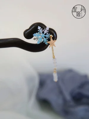 Xiaohan snowflake tassel Chinese hair stick with dark wood pin, blue frosted bead tassels, gold chains, star charm, and blue snowflake ornament