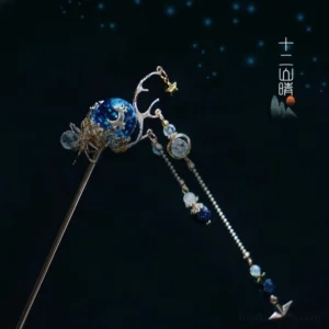 Front close-up of Xingyue celestial Chinese hair stick featuring a galaxy blue bead, gold antler inspired decoration, beaded tassels, and star pendants