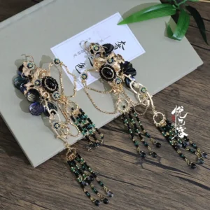 Yao Yue Lian pair of long Hanfu hairpins with antique gold filigree, black oval gem accents, dark green beads and black tassels