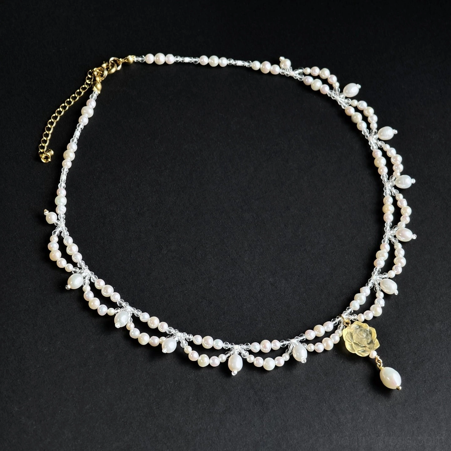 Yellow carved rose pearl yingluo Chinese necklace with teardrop freshwater pearl pendant and gold toned extension chain