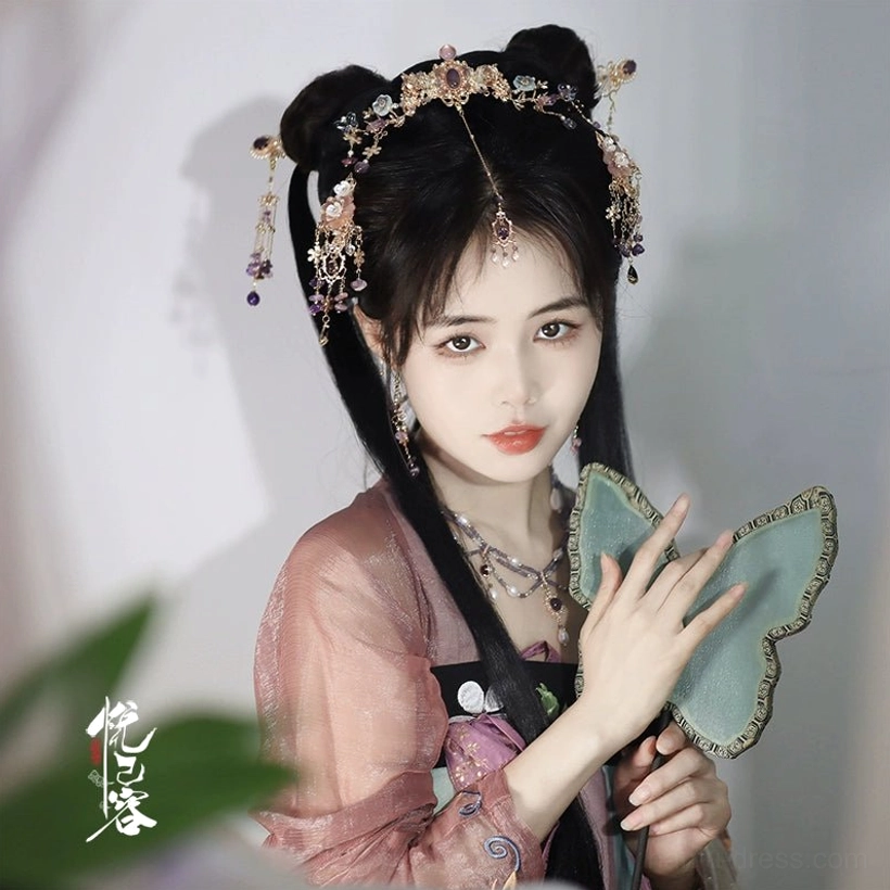 Front three quarter portrait of Yexian Hanfu hair accessory set with floral gems tassels and traditional double bun hairstyle