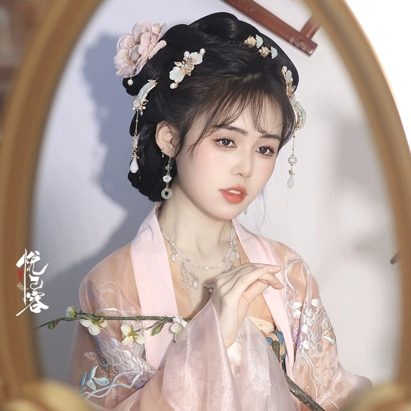 Elegant traditional Chinese Hanfu hairstyle featuring Yulan jade tassel hair accessories with pink embroidered sheer Hanfu coat