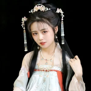 Model wearing Yun Luo Yi inspired Hanfu hair jewelry styling with purple gemstone tassel accessories