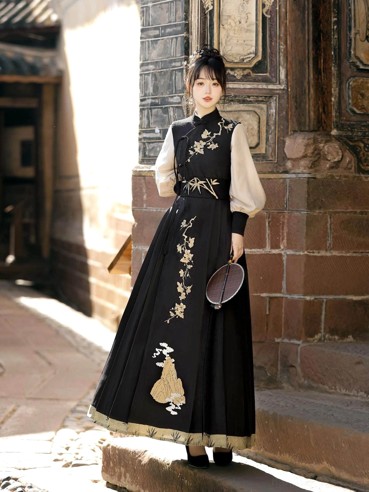 Side view of Yunshan Chinese chivalrous Hanfu outfit featuring gold floral and mountain embroidery, lantern sleeves and black pleated skirt