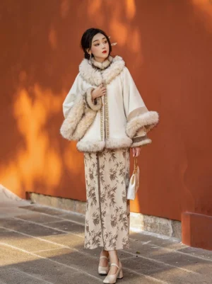 Full body model wearing the Zhaojun modern Hanfu winter cheongsam dress and chenille velvet cape jacket in a traditional red courtyard