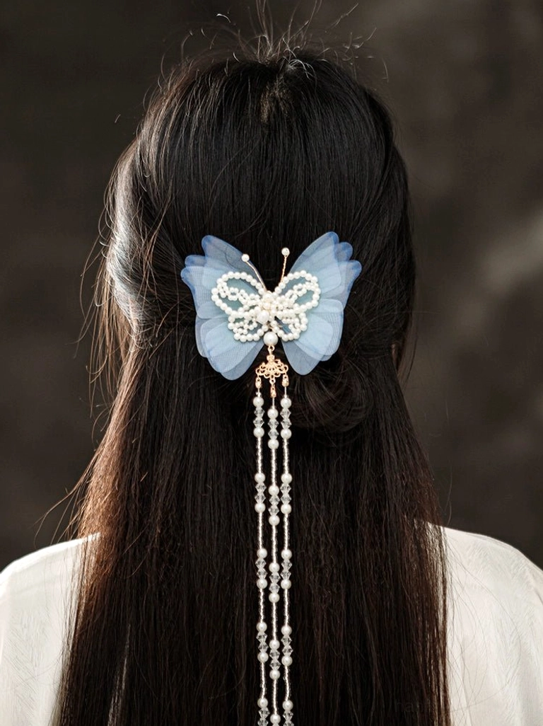 Blue butterfly beaded tassel back hair pin styled in a half up hairstyle for Hanfu and Chinese traditional outfits