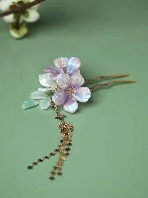 Close-up of Ziqing Chinese style purple flower hair pin with layered gold tassels for Hanfu and qipao hair styling